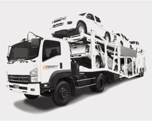 Priority auto transport truck relocating vehicles from Colorado to Virginia on a major interstate route