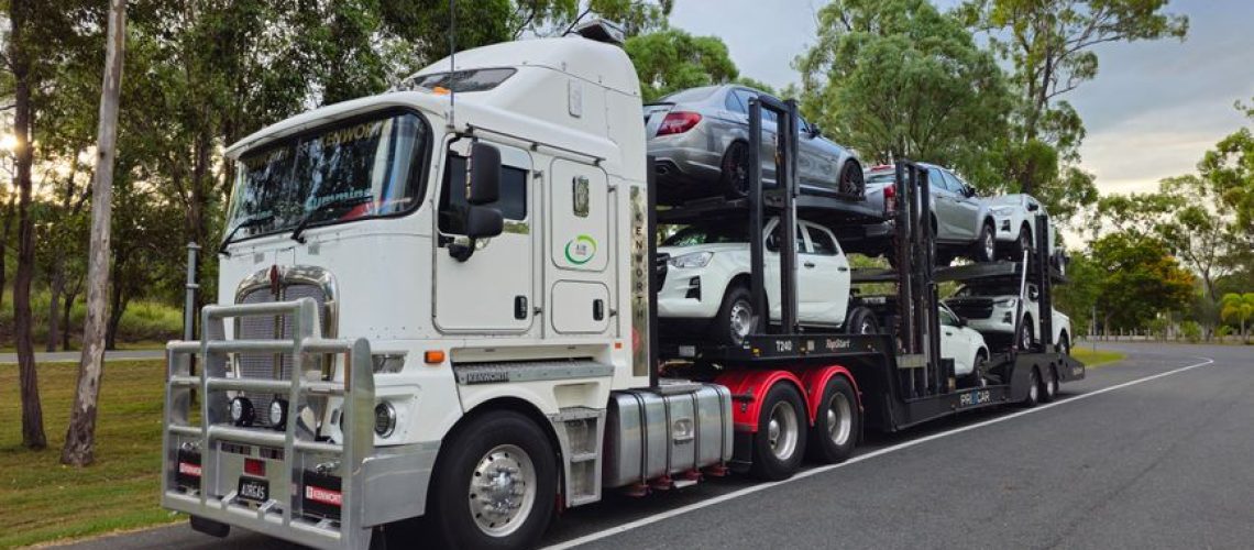 Car being loaded onto an auto transport truck showcasing benefits